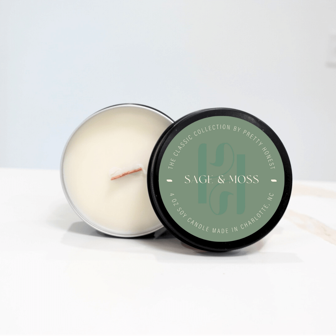 Travel-sized candle tin with floral scent, ideal for weekend getaways
